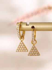 Detailed close-up of golden triangle drop earrings inlaid with sparkling zircon stones