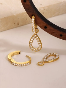 Detail of 18k gold plated stainless steel earrings with zircon teardrop charms