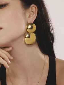 Boucles d'oreilles double disque doré avec finition métallique polie effet miroir