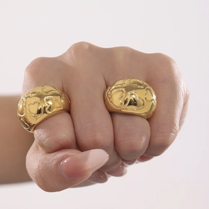 Polished gold dome rings with heart pattern engraving for a bold statement look