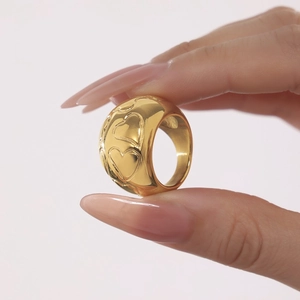 Polished wide gold stainless steel ring with embossed 3D heart patterns for women