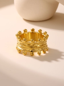 Detailed view of the 18k gold plated stainless steel ring with crown wave texture