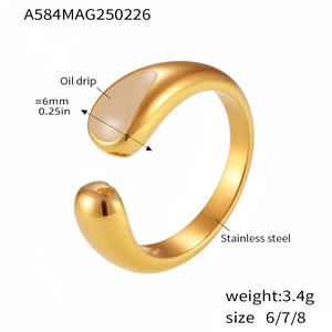 Detail of 18k gold plated stainless steel teardrop ring with brown oil drip design