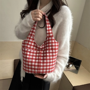 Retro red checkered canvas tote bag with large capacity, shown on model for casual daily use