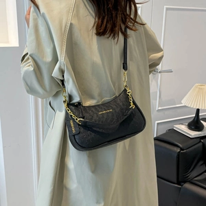 Fashionable black ostrich texture underarm bag with gold chain and crescent design