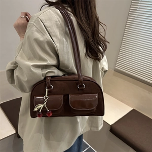 Brown retro Boston underarm bag with matte texture, cherry charm, and dual pockets