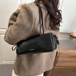 Minimalist black baguette bag with side bow and letter print on shoulder for women
