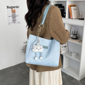Light blue star pattern tote bag with chain strap and cute cloud charm accessory