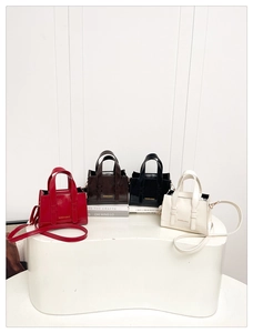 Selection of trendy PU leather mini tote bags in red, brown, black and white colors