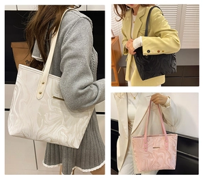 Detailed views of marble pattern tote bags in beige, black, and pink with gold rivets