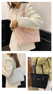 Detail of fashion tote bags in pink, grey and black with marble texture and gold bar
