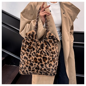 Detail of plush leopard print tote bag with thick woven rope handles and soft texture