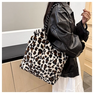 Detail of plush leopard print tote bag showing large capacity and soft faux fur texture