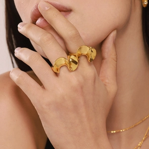 Polished gold plated irregular twisted double finger ring with a fluid wavy design