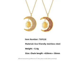 Detail view of crescent moon and sun pendants in 18K gold plated stainless steel