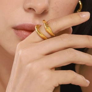 Minimalist 18K gold plated stainless steel wave ring with polished organic texture