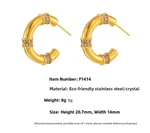 Detailed specs of gold C-shape stainless steel earrings with paved rhinestones