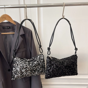 Sparkly sequin shoulder bag with leather straps and knotted detail in black and silver
