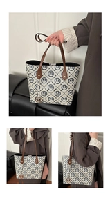 Detail of beige monogram tote bag showing leather handles and gold metal M charm