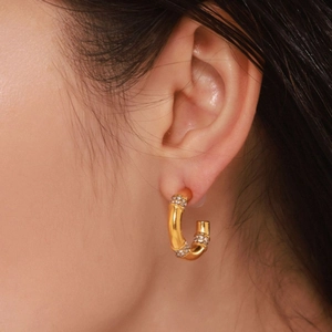 C-shaped bamboo design earrings in 18K gold plating with sparkling rhinestones