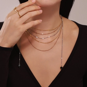 Layered 18k gold plated necklace with multi-tone chains and natural stone charms
