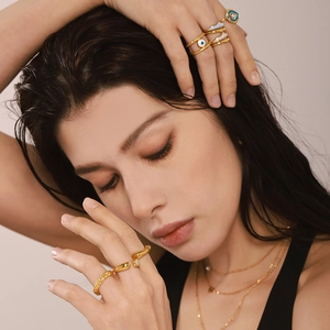 Irregular 18K gold plated stackable ring set with blue evil eye enamel details