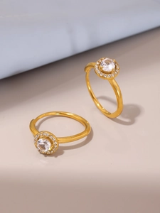 Detailed view of gold plated hoop earrings with shimmering white zircon stones