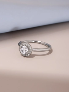 Detailed view of silver halo ring with a large round central zircon and small pave stones