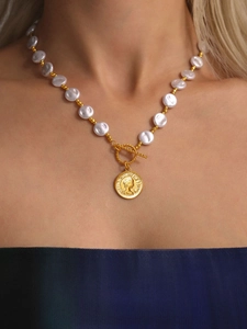 Detail of OT buckle and vintage Elizabeth portrait pendant on a long beaded necklace