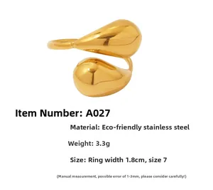 Detail of golden drop ring showing 1.8cm width measurement and 3.3g weight specs