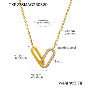 Macro shot of gold double-ring rectangle pendant with zircon inlay on stainless steel chain