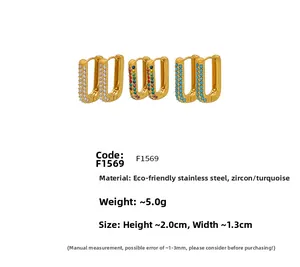 Detail of 20mm gold stainless steel hoop earrings with cubic zirconia and turquoise stones