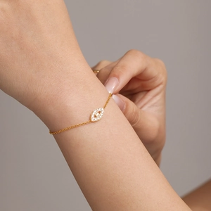 Delicate gold Evil Eye bracelet with pavé 5A zircon stones on a slender stainless steel chain