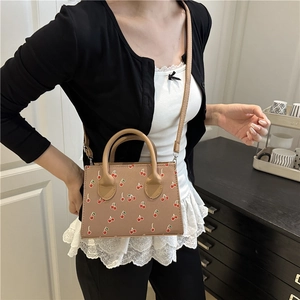 Brown retro crossbody bag with cherry print pattern and leather handle for women