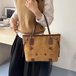 Retro faux suede tote bag for women featuring cute cat embroidery and brown leather handles