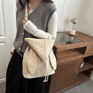 Grand sac à dos beige en suédine avec design oreilles de lapin et cordon de serrage
