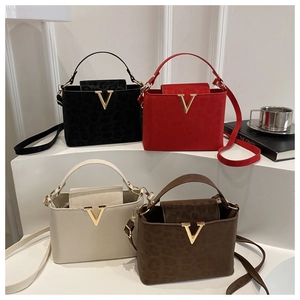 Modern square crossbody bags in black, red, cream, and brown with leopard texture and gold V logo