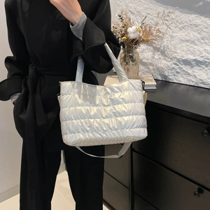 Metallic silver quilted puffer tote bag with large capacity and adjustable strap