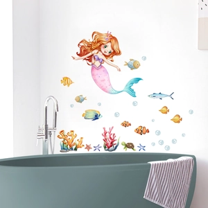 Detailed view of mermaid and ocean creature wall stickers in a cozy bathroom setting