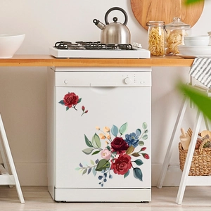 Autocollants fleurs rouges et bleues décorant une façade de lave-vaisselle blanc