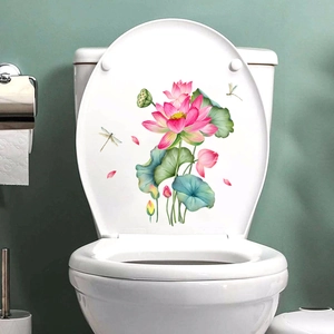 Close-up of waterproof lotus and dragonfly wall stickers on a white toilet cover decor