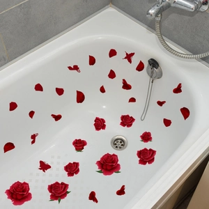 Detailed view of red rose petals and butterfly waterproof stickers on bathtub walls