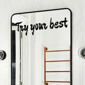 Close-up of Try your best motivational wall sticker on a modern bathroom mirror