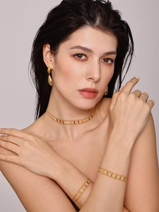 Detailed set of 18k gold plated double-layer diamond shape necklace and earrings on model