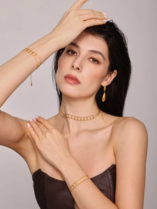 Detail of 18K gold plated double layer necklace and rhombus sequin jewelry set on model