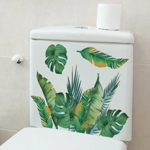 Self-adhesive tropical green palm leaf decals on a white ceramic toilet tank surface