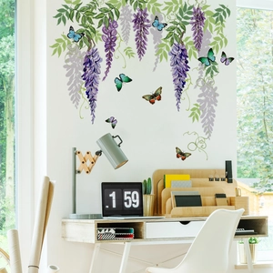 Detailed view of wisteria flowers and butterfly wall decals in a modern desk setting