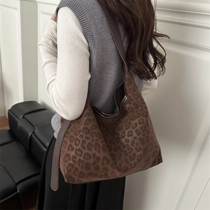 Large leopard print faux suede tote bag for women showing a stylish shoulder carry style