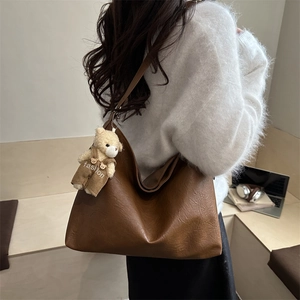 Brown vintage large capacity hobo bag for women with a cute plush bear pendant accessory