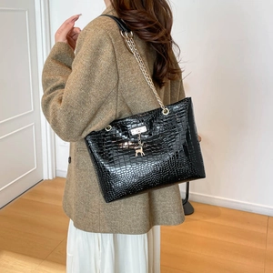 Black crocodile pattern tote bag with gold deer pendant and chain strap for women
